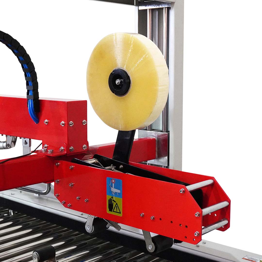 Seladora SXJ-6050AC — detalhe do cabeçote de selamento com rolo de fita