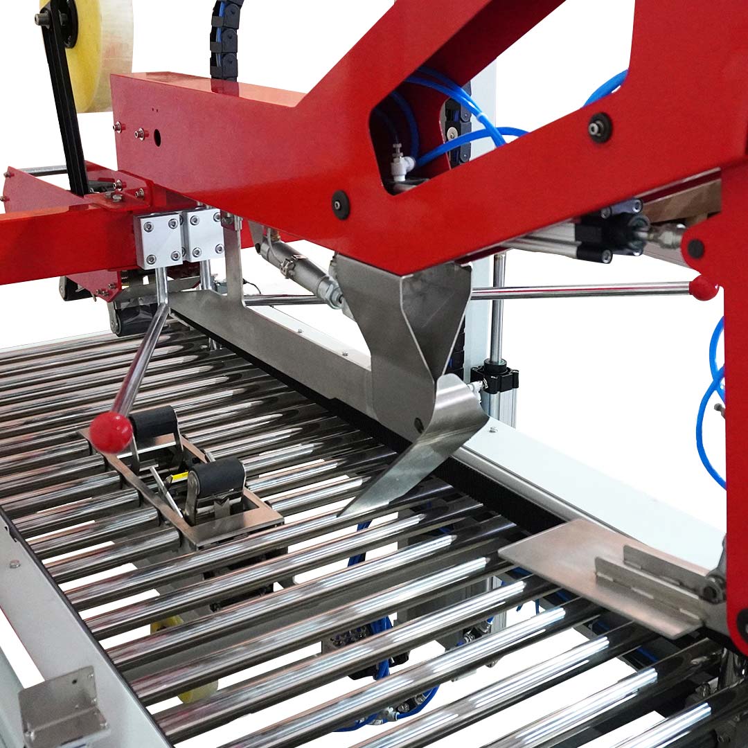 Seladora SXJ-6050AC — detalhe das esteiras inferiores e sistema de aplicação da fita
