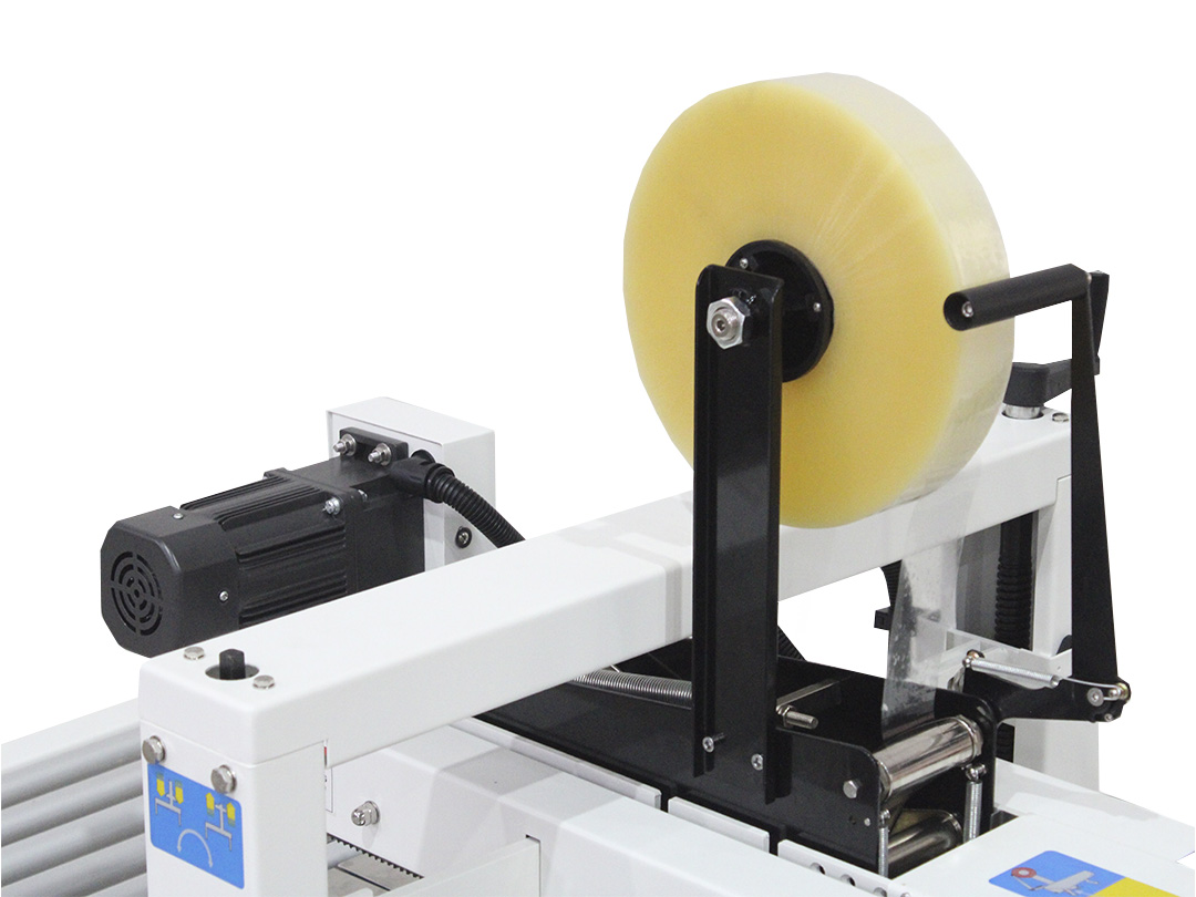Seladora SXJ-6050 — detalhe do cabeçote de selamento com rolo de fita