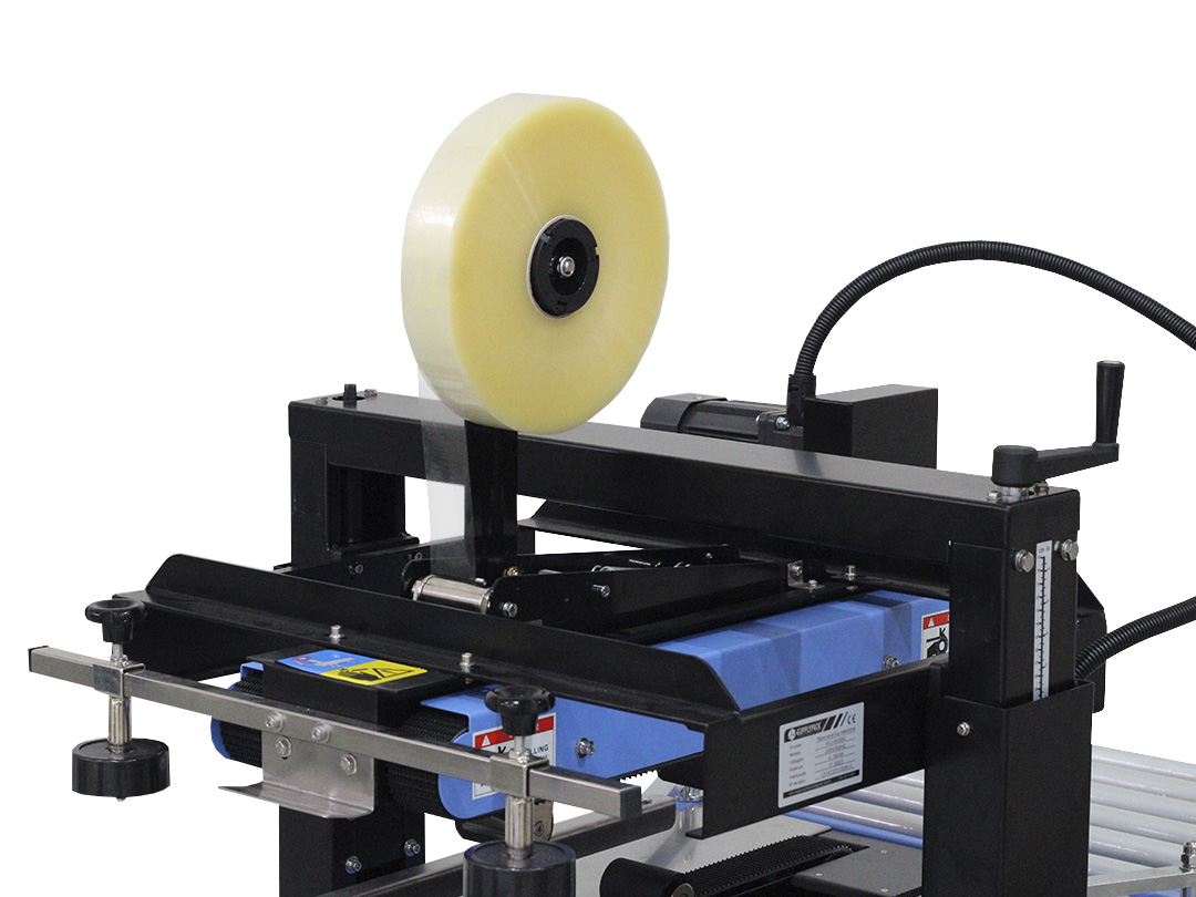 Seladora SXJ-C-6050 — detalhe do cabeçote de selamento com rolo de fita